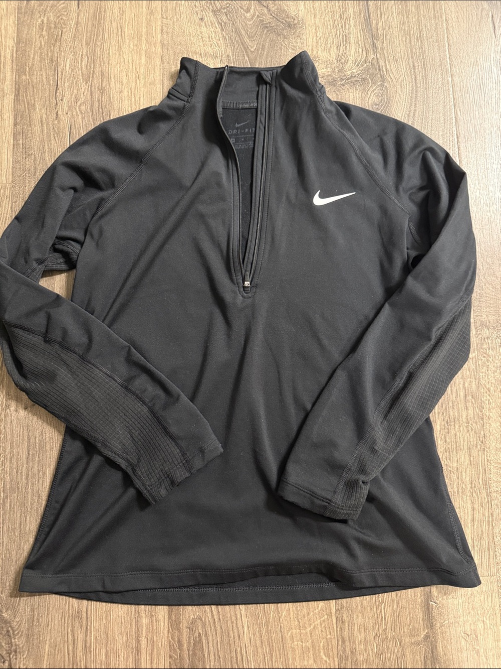Nike women’s Black Half-Zip Performance Pullover with White Swoosh